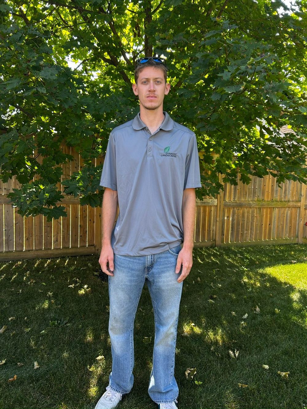 Cole Roden, owner of Dynamic Landscapes, on site in a company polo